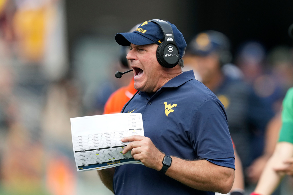 FILE - West Virginia head coach Rich Rodriguez shouts to his players during the second half of an NCAA college football game against Arizona State, Nov. 15, 2025, in Tempe, Ariz. (AP Photo/Ross D. Franklin, File)