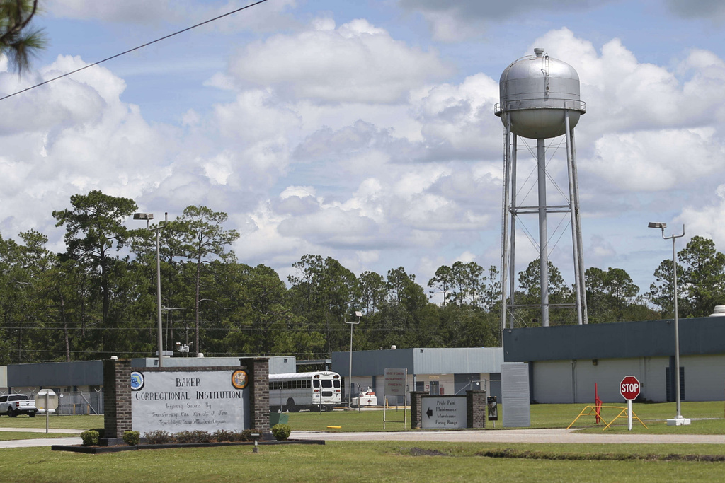A sign marks the entrance to the Baker Correctional Institution, Sanderson, Fla., Thursday, Aug. 14, 2025. (AP Photo/Gary McCullough)