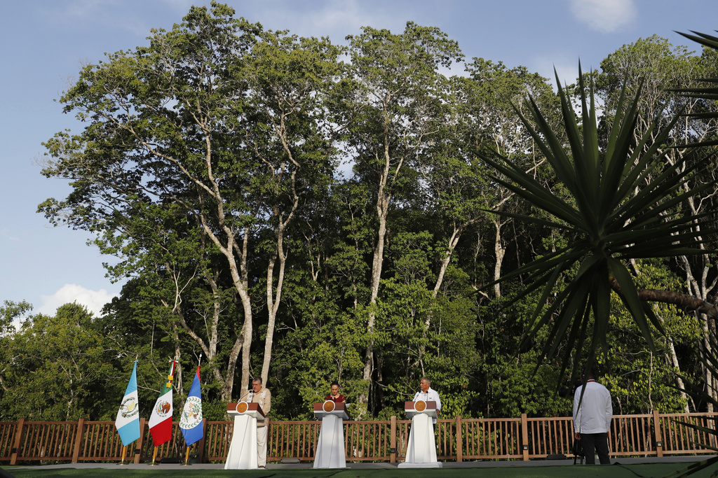 Guatemalan President Bernardo Arévalo, from left, Mexican President Claudia Sheinbaum and Belize Prime Minister Minister Johnny Briceño hold a joint press conference in Calakmul, Campeche state, Mexico, Friday, Aug. 15, 2025. (AP Photo/Martin Zetina)