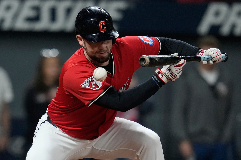 CORRECTION CORRECTS HITTING ON THE FACE BY PITCH - Cleveland Guardians' David Fry is hit in the face by a pitch in the sixth inning of a baseball game against the Detroit Tigers in Cleveland, Tuesday, Sept. 23, 2025. (AP Photo/Sue Ogrocki)
