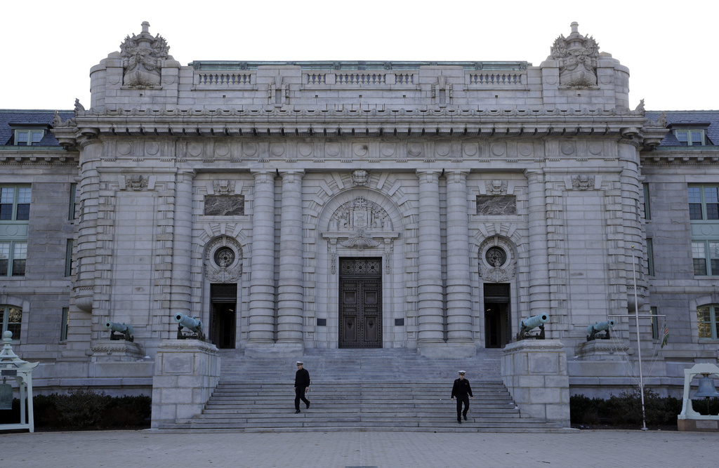 FILE - Midshipmen walk down the front steps of Bancroft Hall, the main dormitory on the U.S. Naval Academy campus in Annapolis, Md., Jan. 9, 2014. (AP Photo/Patrick Semansky, File)