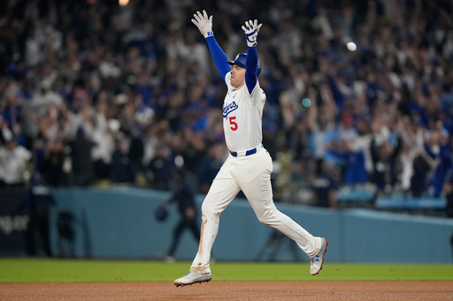 Los Angeles Dodgers' Freddie Freeman celebrates his walk off home run against the Toronto Blue Jays during the 18th inning in Game 3 of baseball's World Series, Monday, Oct. 27, 2025, in Los Angeles. (AP Photo/Brynn Anderson) Los Angeles Dodgers' Freddie Freeman celebrates his walk off home run against the Toronto Blue Jays during the 18th inning in Game 3 of baseball's World Series, Monday, Oct. 27, 2025, in Los Angeles. (AP Photo/Brynn Anderson)