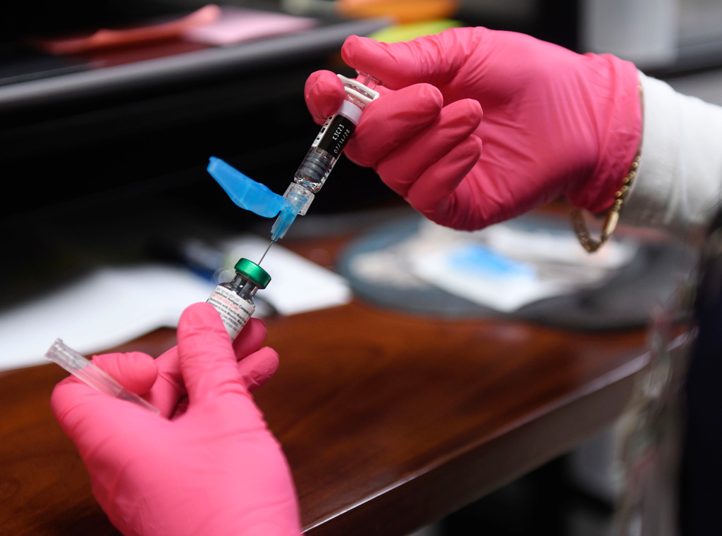 FILE - Anna Hicks prepares a measles, mumps and rubella vaccine at the Andrews County Health Department, Tuesday, April 8, 2025, in Andrews, Texas. (AP Photo/Annie Rice, File)
