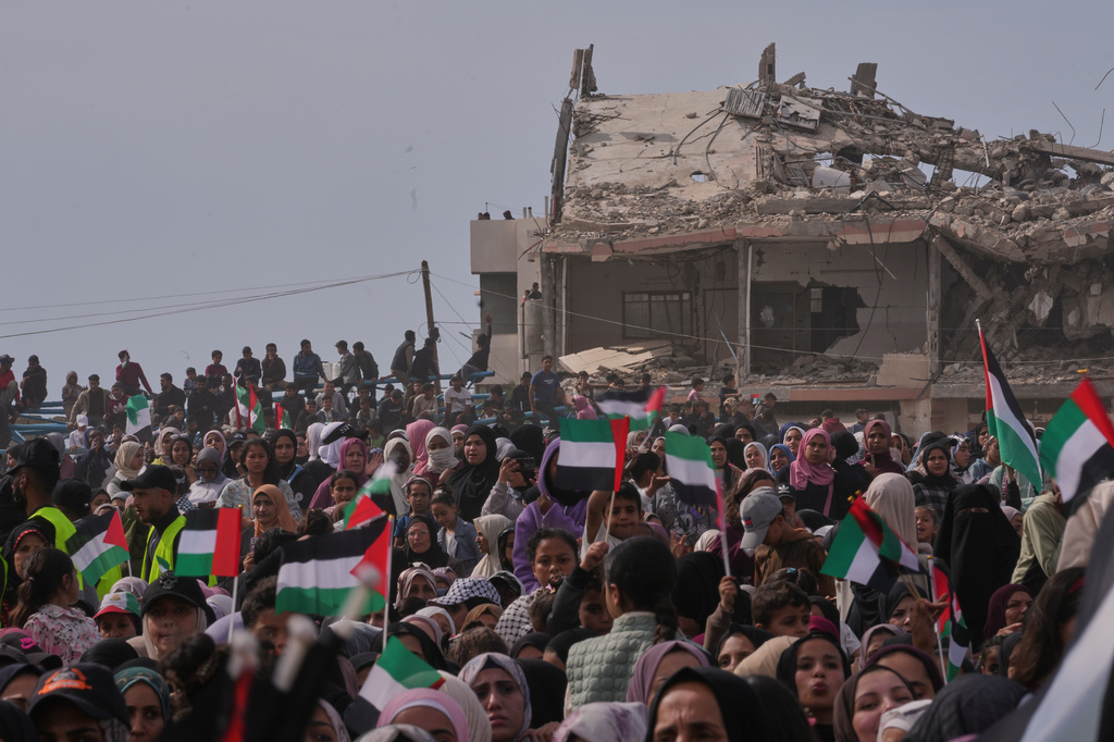 Palestinians watch and celebrate a mass wedding ceremony in Deir al-Balah, central Gaza Strip, Friday, April 24, 2026. (AP Photo/Abdel Kareem Hana)