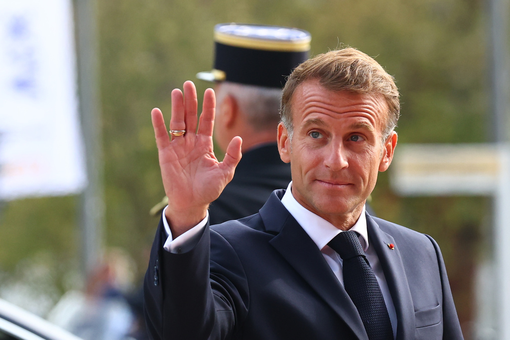 French president Emmanuel Macron waves to the media before a meeting at the Roots of Europe for Peace and Unity with Pope Leo XIV, Monday, Sept. 28, 2026, in Metz. (AP Photo/Antonin Utz)