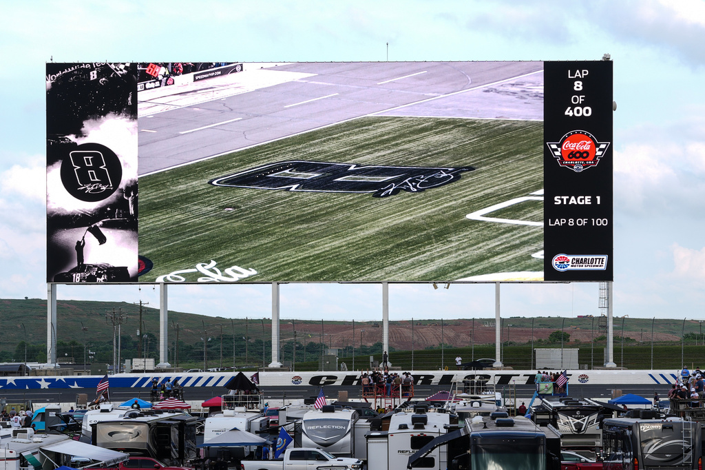 Tribute images are displayed on the backstretch videoboard in honor of late driver Kyle Busch during a NASCAR Cup Series auto race, Sunday, May 24, 2026, in Charlotte, N.C. (AP Photo/Matt Kelley)