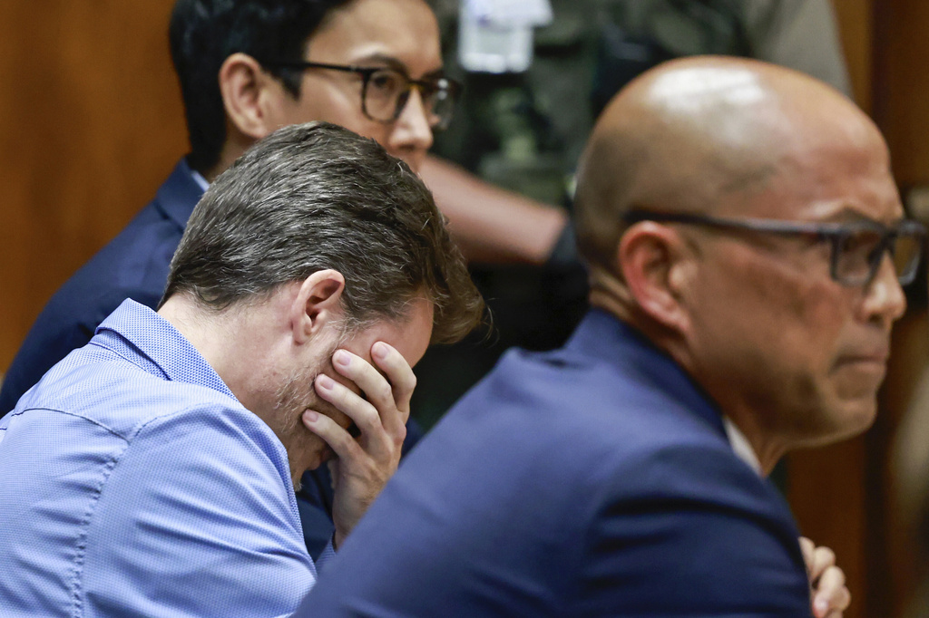 Gerhardt Konig, left, reacts after the verdict is read while sitting with defense attorney Thomas Otake, right, in court Wednesday, April 8, 2026, in Honolulu. (Jamm Aquino/Honolulu Star-Advertiser via AP, Pool)