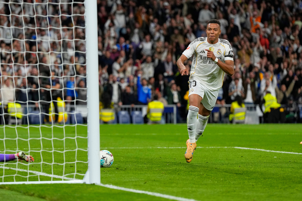 Real Madrid's Kylian Mbappe celebrates after scoring his side's second goal during the Spanish La Liga soccer match between Real Madrid and Valencia in Madrid, Spain, Saturday, Nov. 1, 2025. (AP Photo/Manu Fernandez)