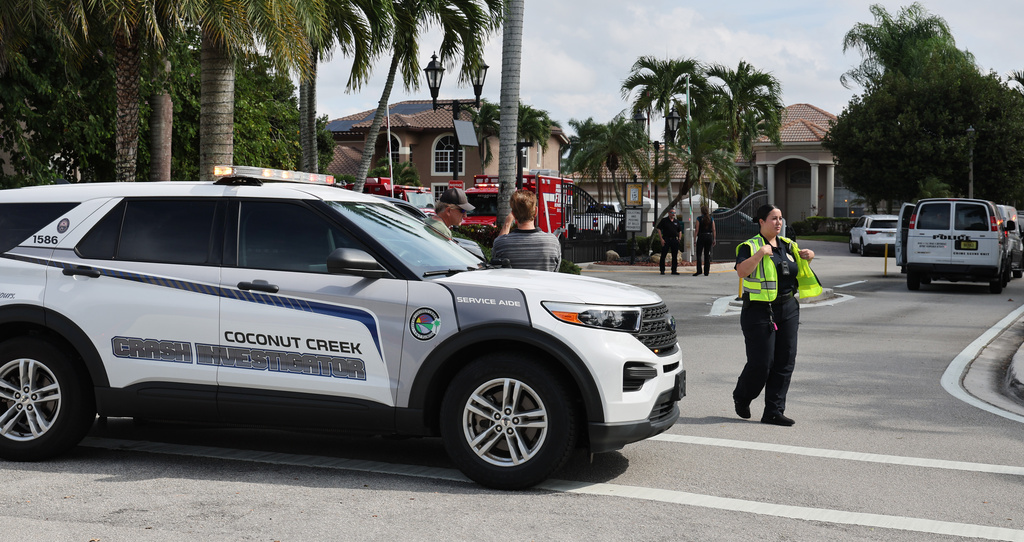 Emergency personnel from Coral Springs and Coconut Creek are on scene where a plane crashed in the Windsor Bay community in Coral Springs on Monday, Nov. 10, 2025. (Carline Jean/South Florida Sun-Sentinel via AP)