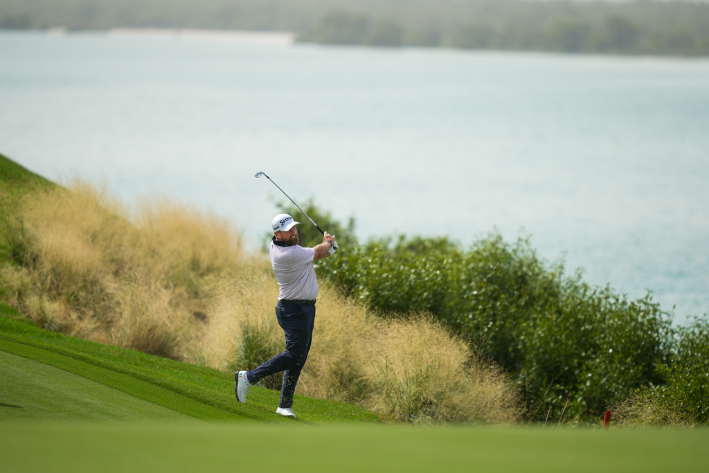 Shane Lowry of Ireland plays his second shot on the 17th hole during the first round of Abu Dhabi Golf Championship in Abu Dhabi, United Arab Emirates, Thursday, Nov. 6, 2025. (AP Photo/Altaf Qadri)