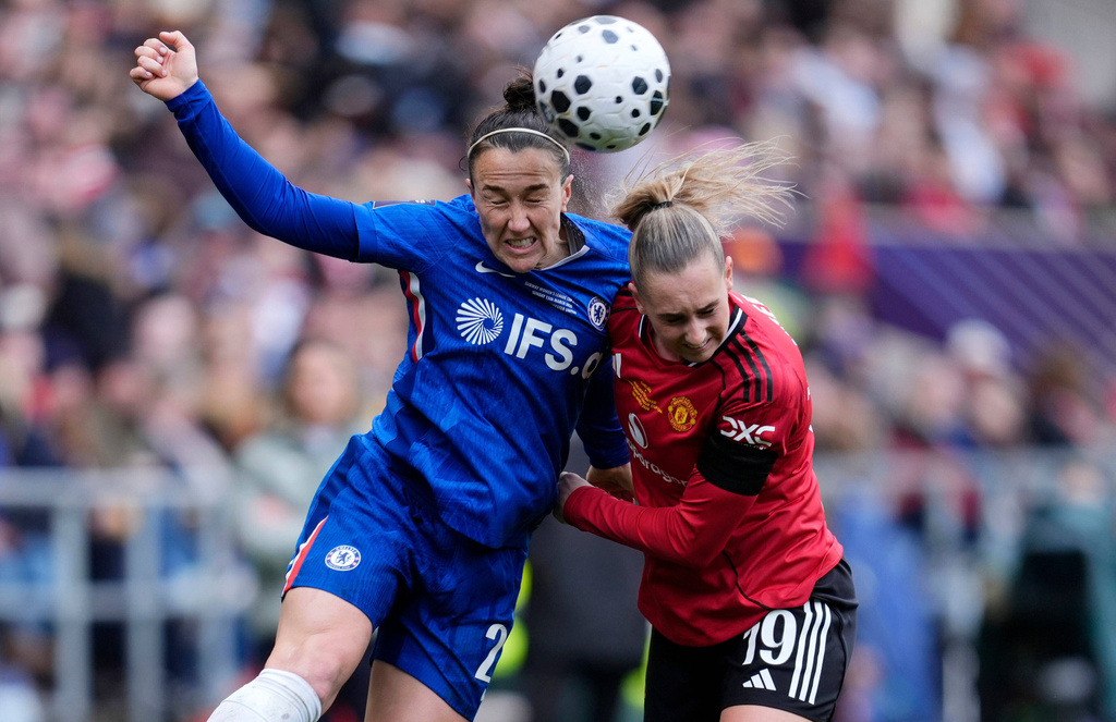 Chelsea's Lucy Bronze, left, and Manchester United's Ellen Wangerheim battle for the ball during the Women's League Cup final, in Bristol, England, Sunday, March 15, 2026. (Nick Potts/PA via AP)