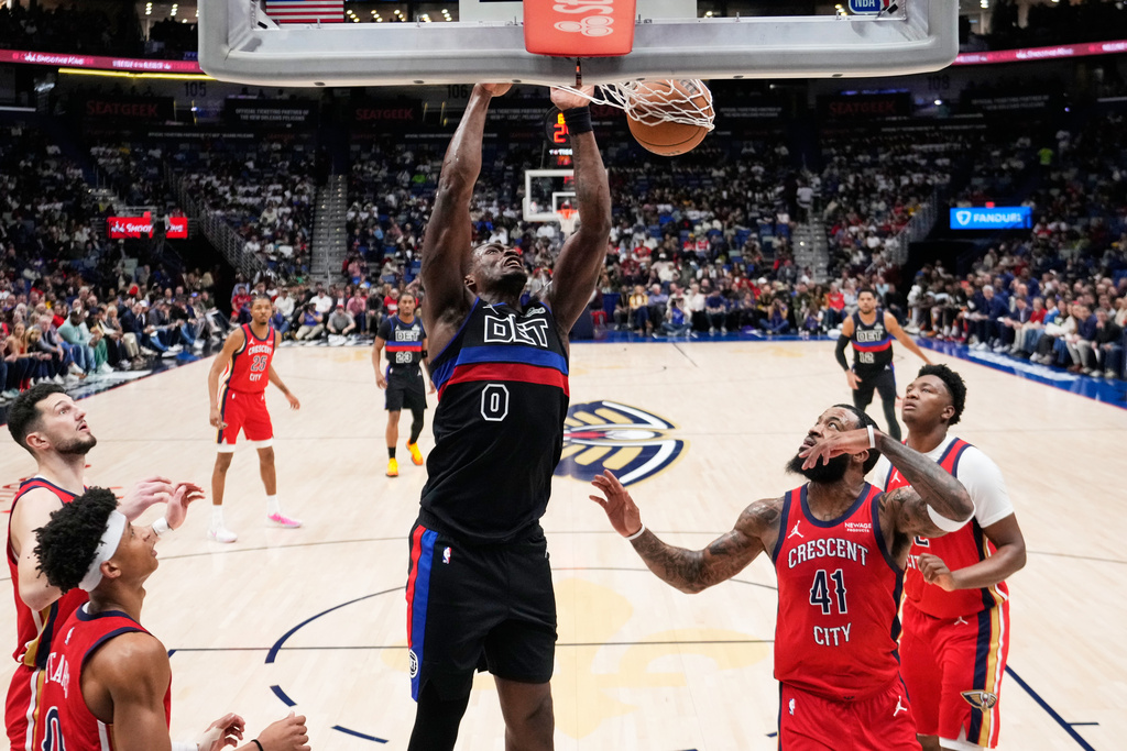 Detroit Pistons center Jalen Duren (0) slam dunks against the New Orleans Pelicans in the first half of an NBA basketball game, Wednesday, Jan. 21, 2026, in New Orleans. (AP Photo/Gerald Herbert)
