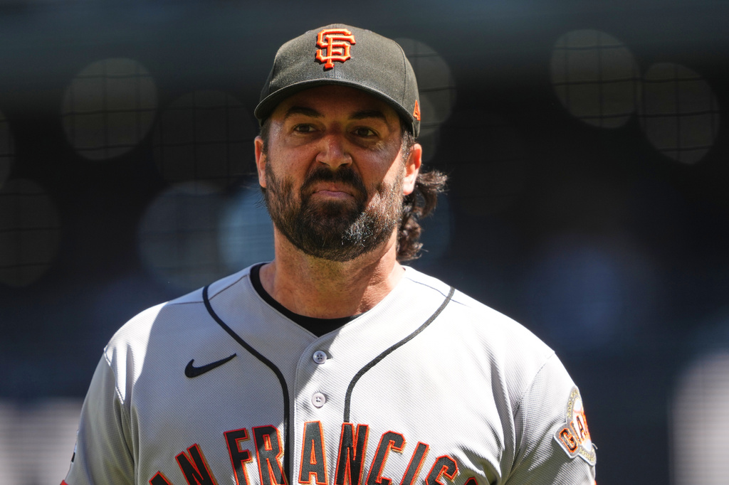 San Francisco Giants starting pitcher Robbie Ray walks back to the dugout after facing the Seattle Mariners in the first inning of a baseball game, Sunday, July 19, 2026, in Seattle. (AP Photo/Lindsey Wasson)