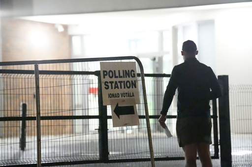 Early voters arrive at Scoil Mhichil Naofa (St Michael's National School) in Athy, Co Kildare, as voting beings in Ireland's presidential election, Friday, Oct. 24, 2025. (Niall Carson/PA via AP) Early voters arrive at Scoil Mhichil Naofa (St Michael's National School) in Athy, Co Kildare, as voting beings in Ireland's presidential election, Friday, Oct. 24, 2025. (Niall Carson/PA via AP)