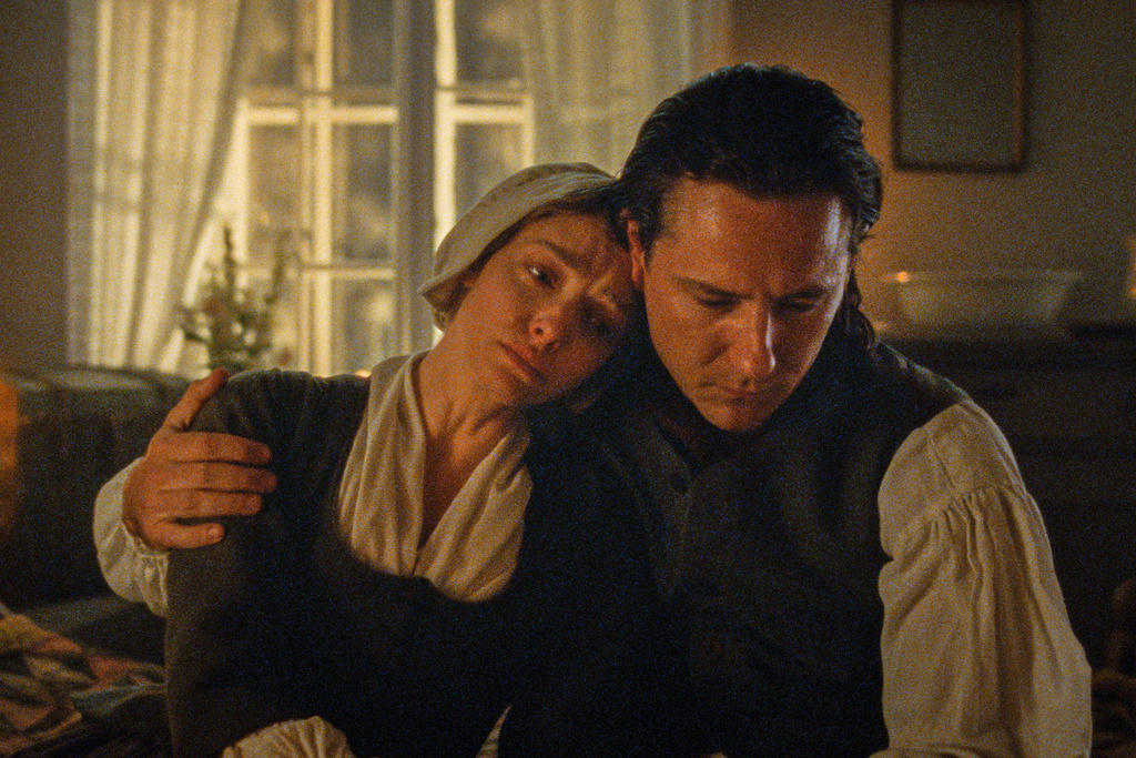 This image released by Searchlight Pictures shows Amanda Seyfried, left, and Lewis Pullman in a scene from "The Testament of Ann Lee." (Searchlight Pictures via AP)