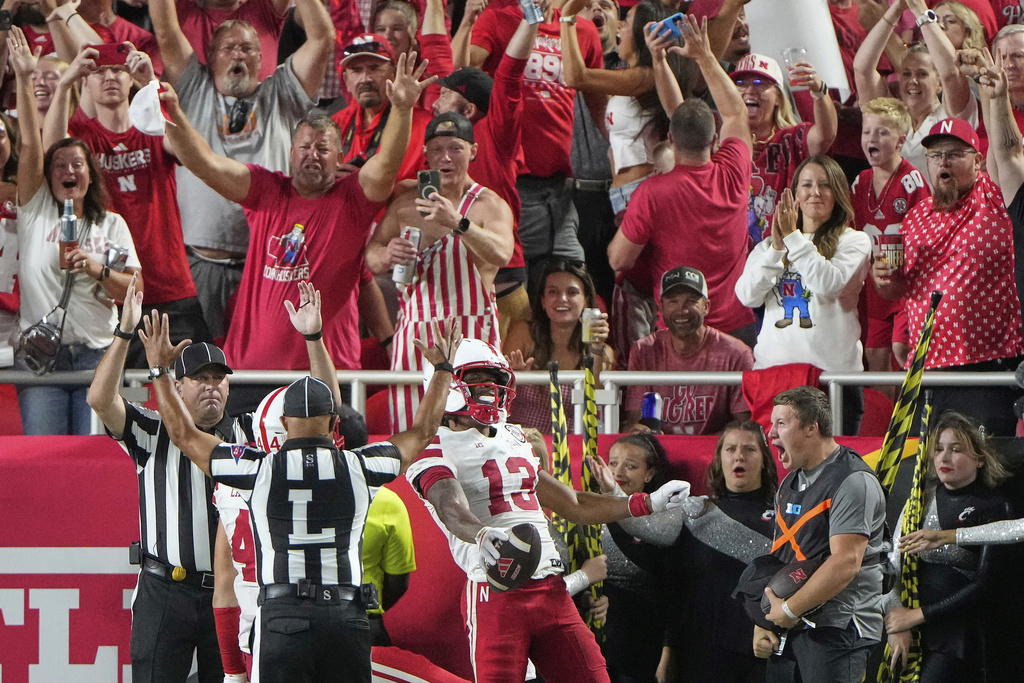 Nebraska wide receiver Nyziah Hunter (13) celebrates after scoring a touchdown during the first half of an NCAA college football game against Cincinnati Thursday, Aug. 28, 2025, at Arrowhead Stadium in Kansas City, Mo. (AP Photo/Charlie Riedel)