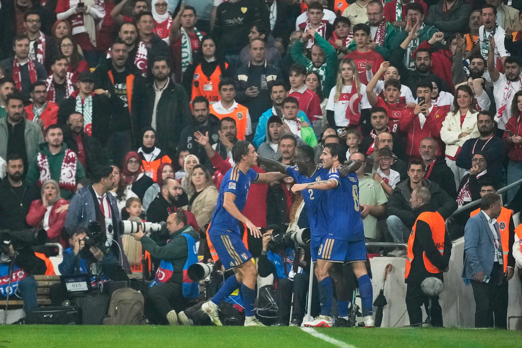 Italy's Michael Kayode, centre, celebrates with teammates after scoring his side's third goal during the UEFA Nations League soccer match between Turkey and Italy in Bursa, Turkey, Monday, Sept. 28, 2026. (AP Photo/Khalil Hamra)