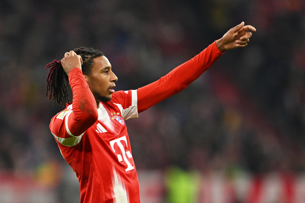 Bayern's Michael Olise during the Bundesliga soccer match between Bayern Munich and Borussia Dortmund in Munich, Germany, Saturday, Oct. 18, 2025. (AP Photo/Lennart Preiss)