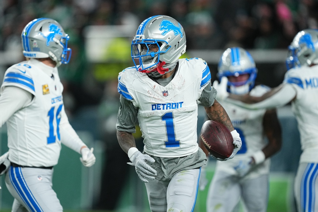 Detroit Lions wide receiver Jameson Williams (1) reacts after scoring a touchdown during the first half of an NFL football game against the Philadelphia Eagles on Sunday, Nov. 16, 2025, in Philadelphia. (AP Photo/Matt Rourke)