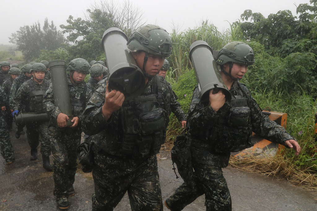 Soldiers move during a military live-fire shooting training in Taichung City, Taiwan, Tuesday, June 9, 2026. (AP Photo/Chiang Ying-ying)