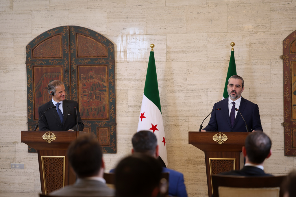 International Atomic Energy Agency's director-general Rafael Mariano Grossi, left, and Syrian Foreign Minister Asaad al-Shibani attend a press conference in Damascus, Syria, Tuesday Aug. 18, 2026. (AP Photo/Ghaith Alsayed)