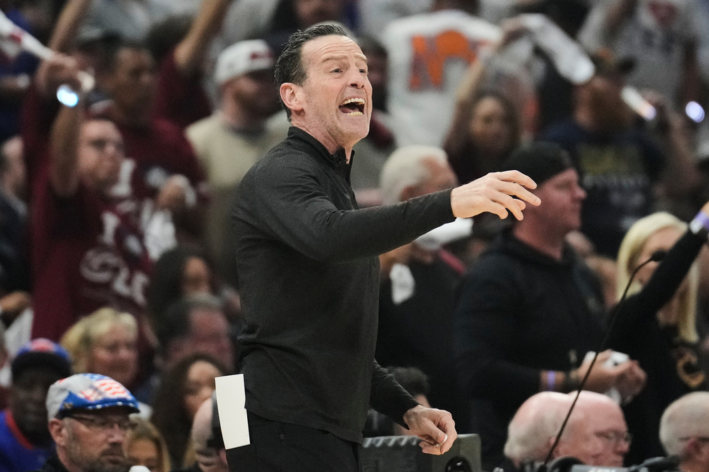Cleveland Cavaliers head coach Kenny Atkinson yells from the sideline during the first half of Game 4 in the Eastern Conference finals NBA basketball playoffs series against the New York Knicks in Cleveland, Monday, May 25, 2026. (AP Photo/Sue Ogrocki)