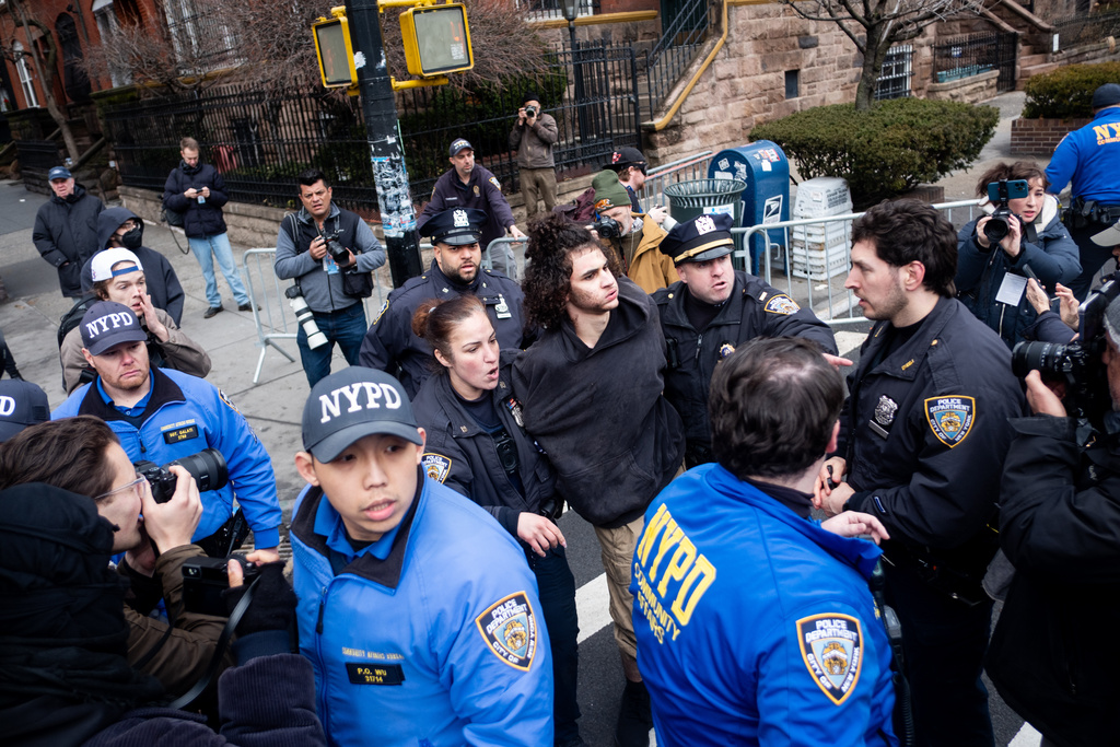 Police detain Emir Balat after he attempted to detonate an improvised explosive device during a counterprotest against far right influencer Jake Lang staging an anti-Islam protest outside Gracie Mansion, Saturday, March 7, 2026, in New York. (AP Photo/Julius Constantine Motal)