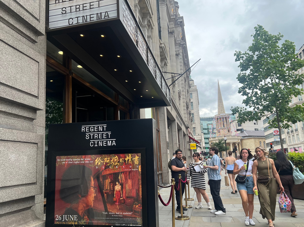 In this photo released by Xinhua News Agency, a poster is displayed outside a cinema before the premiere of Chinese film "Dear You" in London, on June 20, 2026. (Zhao Jiasong/Xinhua via AP)