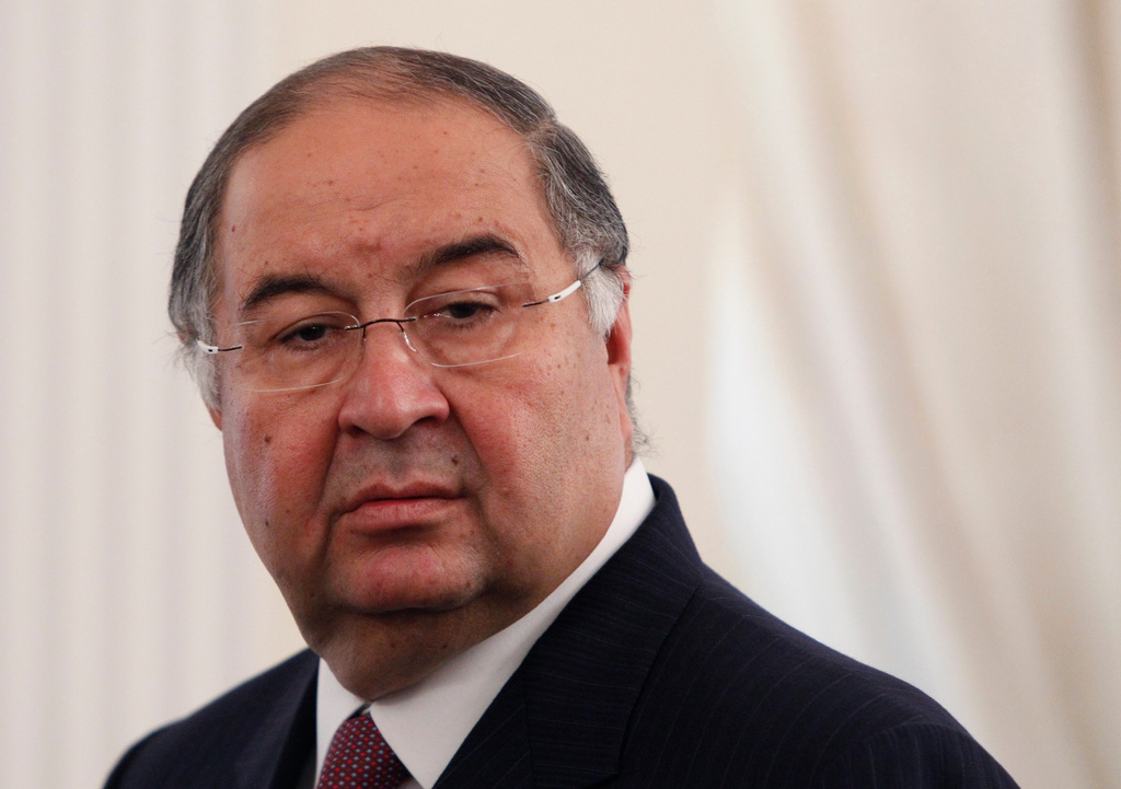 FILE - Uzbek-born Russian businessman Alisher Usmanov attends a meeting of Russian President Vladimir Putin and Crown Prince Sheik Mohammed bin Zayed Al Nahyan of the United Arab Emirates at the Novo-Ogaryovo state residence outside Moscow, Sept. 12, 2013. (Maxim Shemetov/Pool Photo via AP, File)