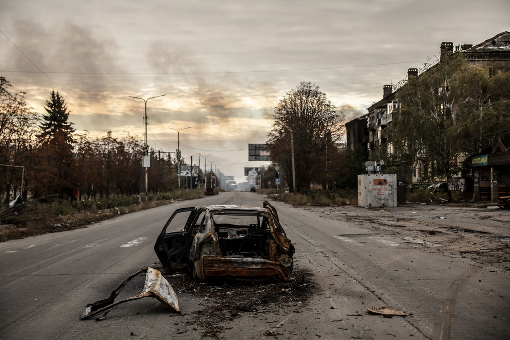 In this photo taken on Oct.13, 2025 and provided by Ukraine's 24th Mechanized Brigade press service, a damaged private car is seen in Kostiantynivka, a frontline town where some 5000 people still stay with no water, electricity and gas supply in the site of heaviest battles with the Russian troops in the Donetsk region, Ukraine. (Oleg Petrasiuk/Ukraine's 24th Mechanized Brigade via AP)