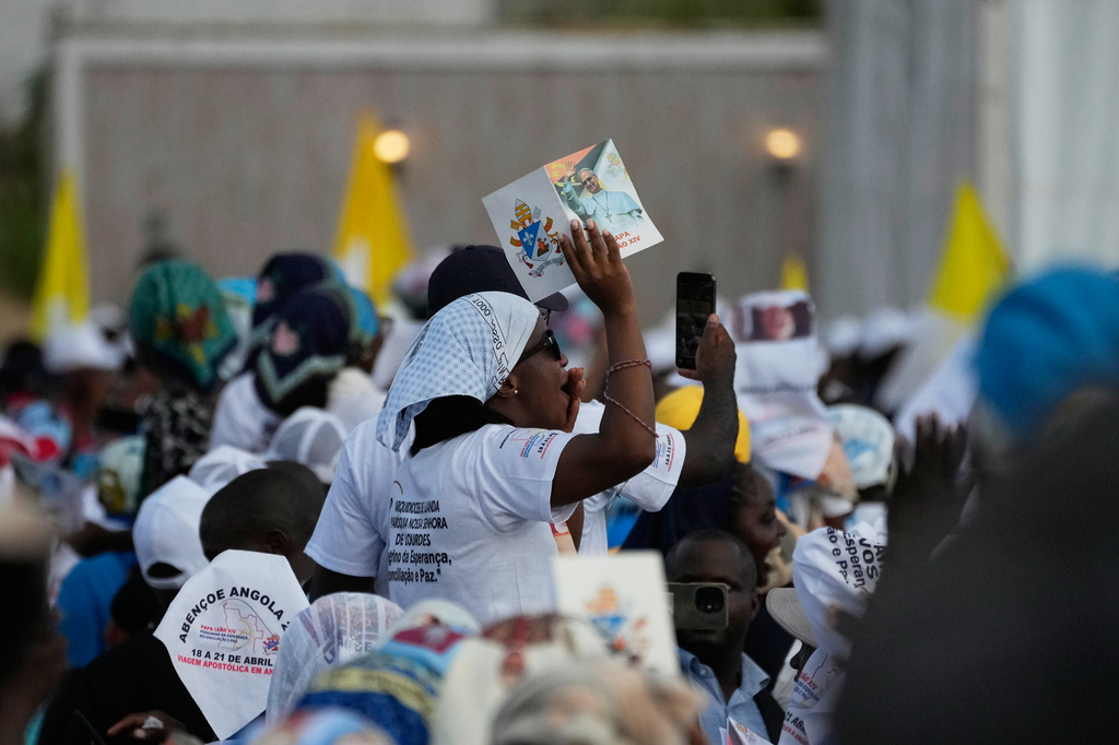 Parishioners wait for Pope Leo XIV's arrival at the esplanade in front of the Sanctuary of Mama Muxima, in Muxima, Angola, Sunday, April 19, 2026. (AP Photo/Themba Hadebe)