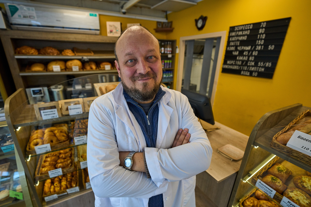 Denis Maksimov poses for a photo in the sales area of his bakery outside Moscow, Russia, on Wednesday, Feb. 18, 2026. (AP Photo/Alexander Zemlianichenko)