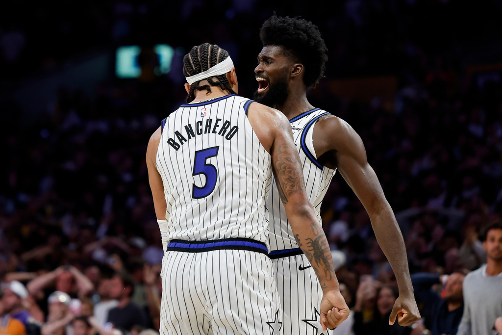 Orlando Magic forward Paolo Banchero (5) and Orlando Magic forward Jonathan Isaac (1) react at the end of the game as the Orlando Magic defeat the Los Angeles Lakers during an NBA basketball game Tuesday, Feb. 24, 2026, in Los Angeles. (AP Photo/Caroline Brehman)