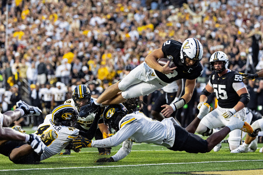 Vanderbilt quarterback Diego Pavia (2) dives over the Missouri defense for a touchdown during the second half of an NCAA college football game Saturday, Oct. 25, 2025, in Nashville, Tenn. (AP Photo/Wade Payne) Vanderbilt quarterback Diego Pavia (2) dives over the Missouri defense for a touchdown during the second half of an NCAA college football game Saturday, Oct. 25, 2025, in Nashville, Tenn. (AP Photo/Wade Payne)