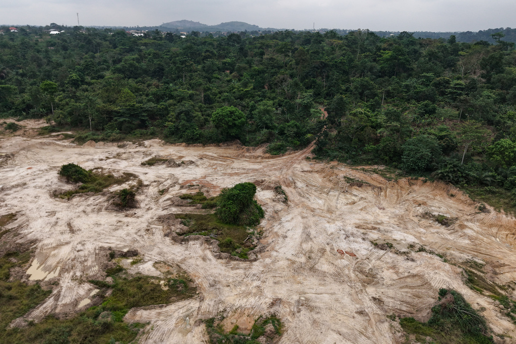 A drone view shows a section of a cocoa farm given over to sand mining in Kona, Ghana, Friday, March 6, 2026. (AP Photo/Tsraha Yaw)