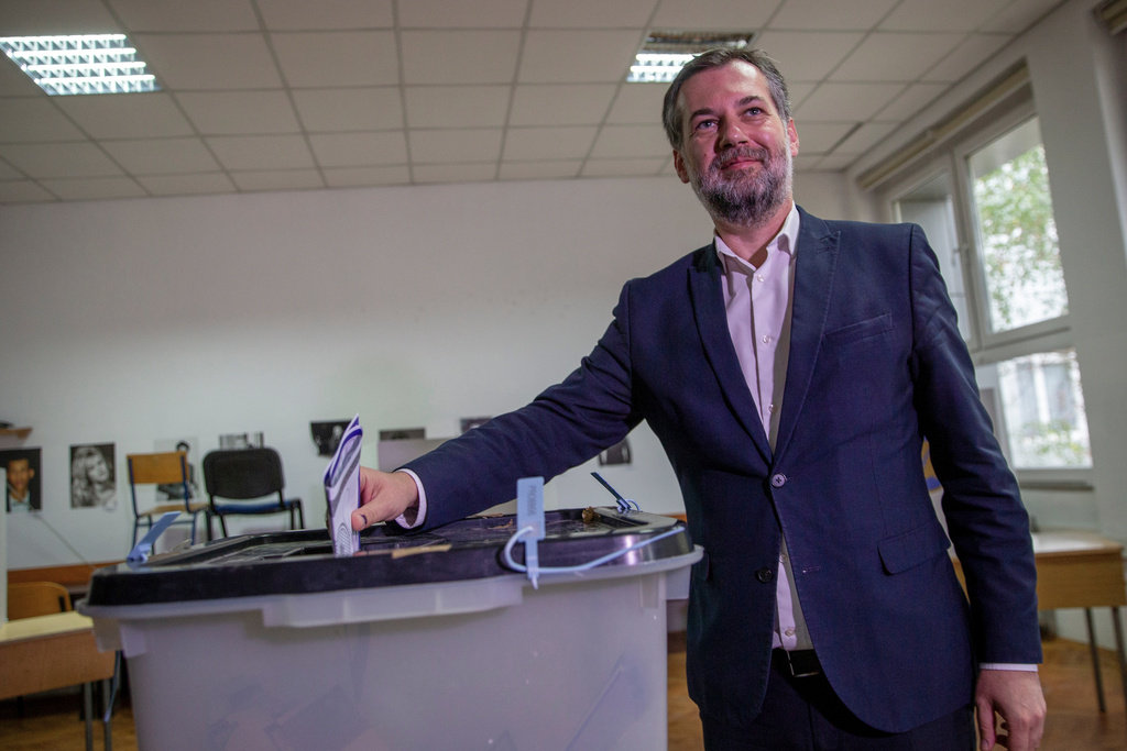 Hajrullah Ceku, candidate for the mayor from the VeteVendosje (SelfDetermination) political party casts his ballot on Sunday's municipal elections in Pristina, Kosovo on Sunday, Oct. 12, 2025.(AP Photo/Visar Kryeziu)