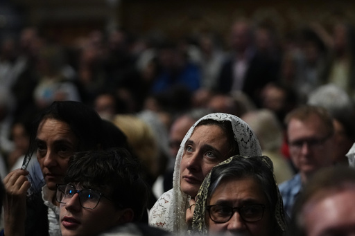 A woman attends a mass celebrated by Cardinal Raymond Leo Burke in St. Peter's Basilica, at the Vatican, Saturday, Oct. 25, 2025. (AP Photo/Alessandra Tarantino) A woman attends a mass celebrated by Cardinal Raymond Leo Burke in St. Peter's Basilica, at the Vatican, Saturday, Oct. 25, 2025. (AP Photo/Alessandra Tarantino)