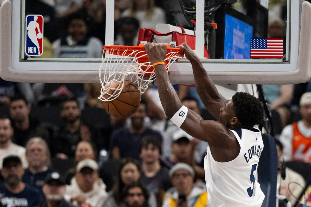 Minnesota Timberwolves guard Anthony Edwards (5) dunks during the first half of an NBA basketball game against the Los Angeles Clippers Thursday, Feb. 26, 2026, in Inglewood, Calif. (AP Photo/Kyusung Gong)