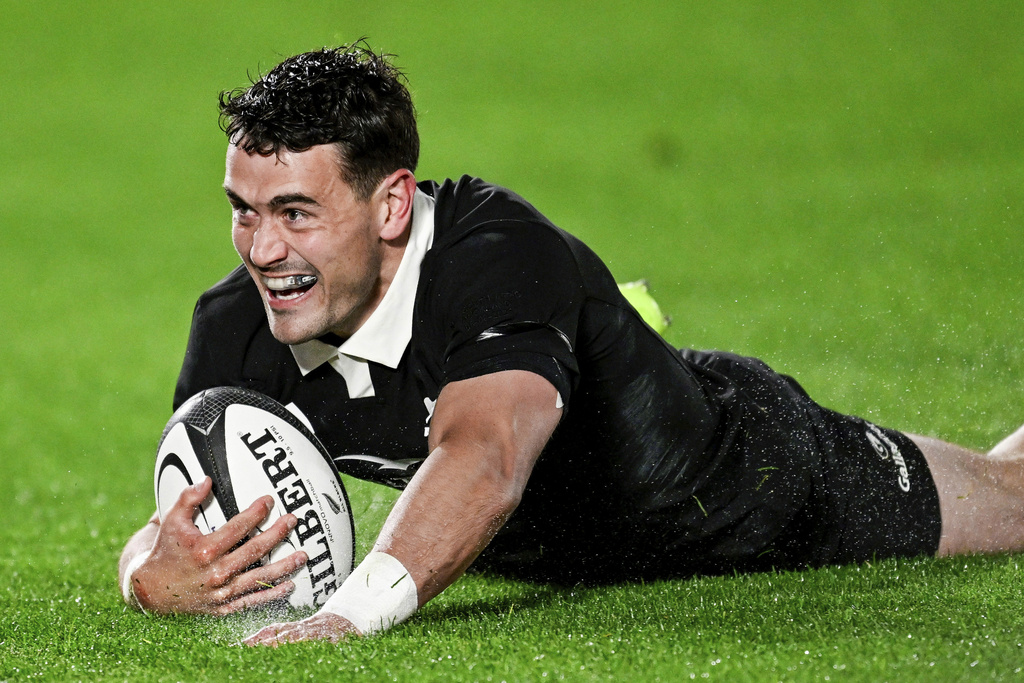 Will Jordan of New Zealand scores a try during their rugby international against the Springboks at Eden Park in Auckland, New Zealand, Saturday, Sept. 6, 2025. (Andrew Cornaga/Photosport via AP)