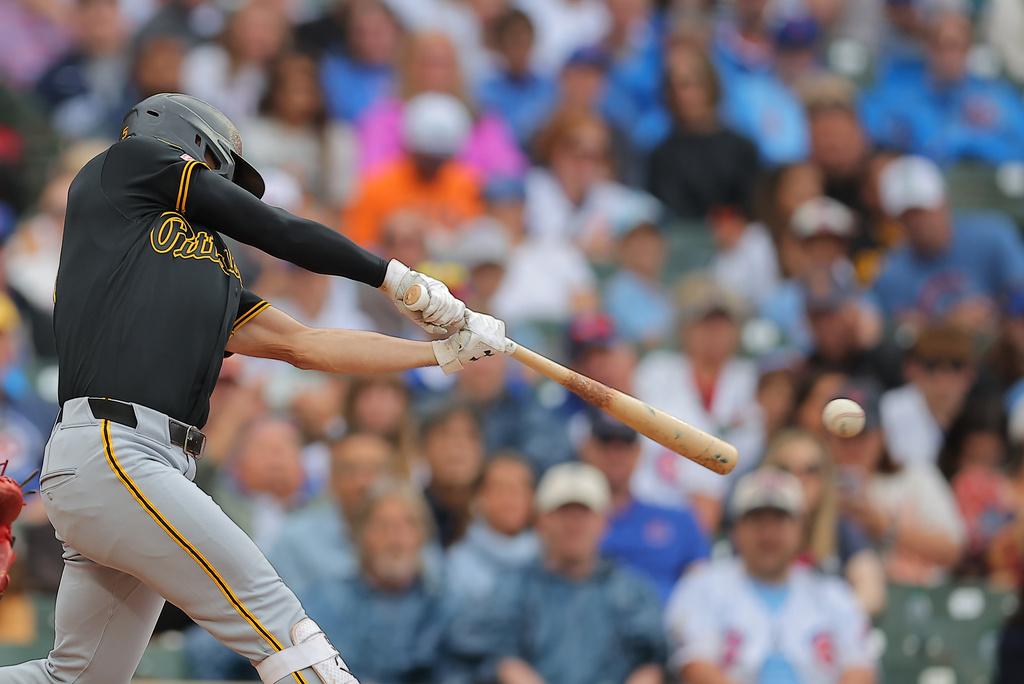 Pittsburgh Pirates' Brandon Lowe hits a two-RBI single during the sixth inning of a baseball game against the Chicago Cubs, Sunday, Sept. 13, 2026, in Chicago. (AP Photo/Melissa Tamez)