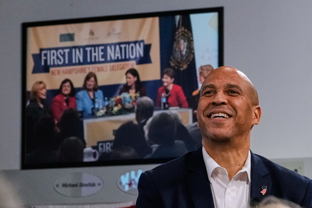 Sen. Cory Booker, D-N.J., listens to a question during a gathering Friday, Nov. 14, 2025, in Manchester, N.H. (AP Photo/Charles Krupa)