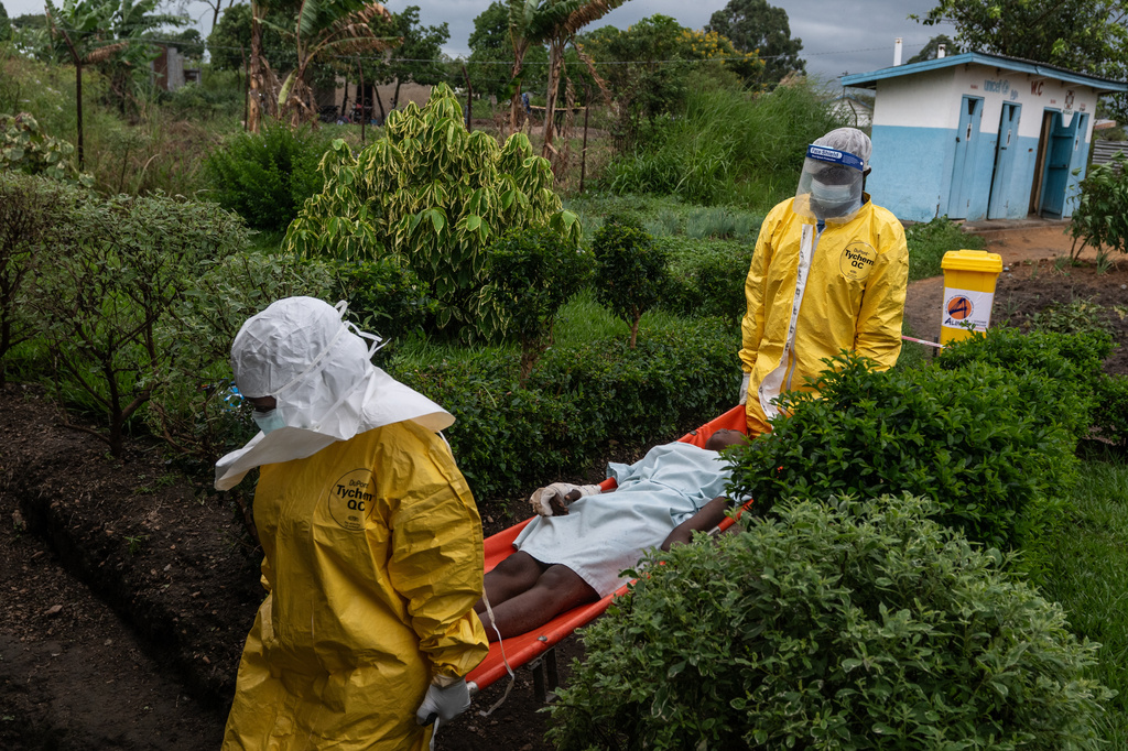 FILE - Medical staff carry an Ebola patient to a treatment center in Rwampara, Congo, Thursday, May 21, 2026. (AP Photo/Moses Sawasawa, file)