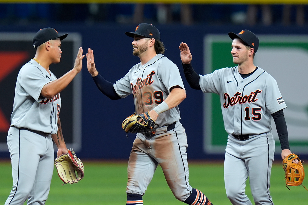 Detroit Tigers, from left, Hao-Yu Lee, Zach McKinstry, and Zack Short, celebrate after the team defeated the Tampa Bay Rays during a baseball game Monday, June 1, 2026, in St. Petersburg, Fla. (AP Photo/Chris O'Meara)
