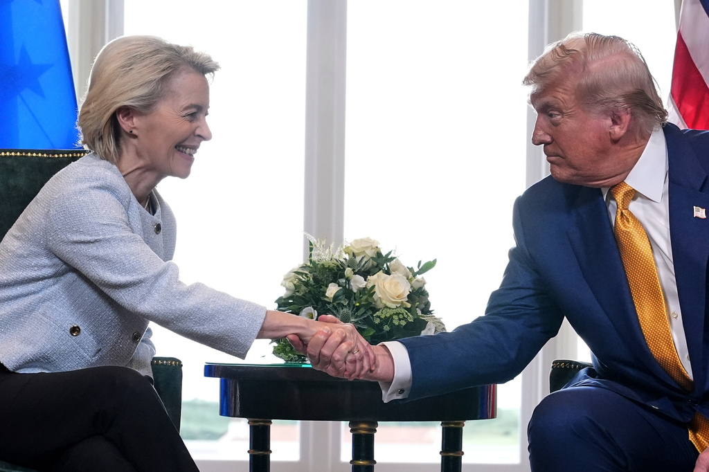 FILE - President Donald Trump and European Commission President Ursula von der Leyen shake hands after reaching a trade deal at the Trump Turnberry golf course in Turnberry, Scotland, on July 27, 2025. (AP Photo/Jacquelyn Martin, File)