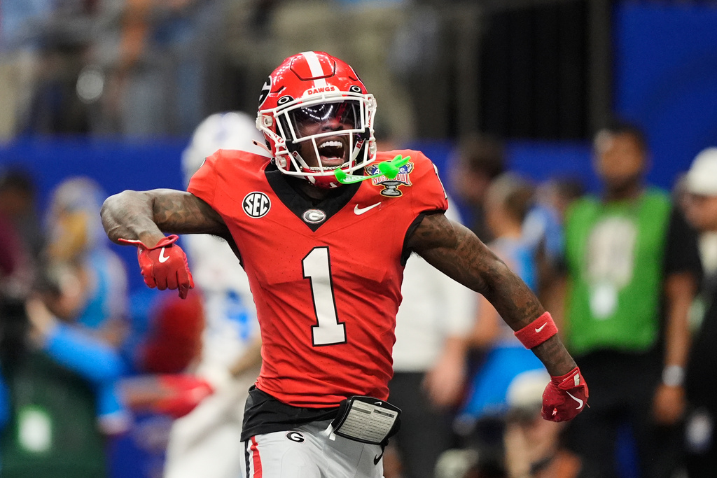 Georgia wide receiver Zachariah Branch (1) celebrates a touchdown in the second half of the Sugar Bowl NCAA college football playoff quarterfinal game against Mississippi in New Orleans, Thursday, Jan. 1, 2026. (AP Photo/Gerald Herbert)