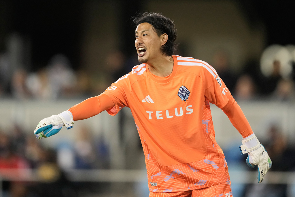 Vancouver Whitecaps goalkeeper Yohei Takaoka gestures toward teammates during the second half of an MLS soccer match against the San Jose Earthquakes Saturday, May 9, 2026, in San Jose, Calif. (AP Photo/Jeff Chiu)