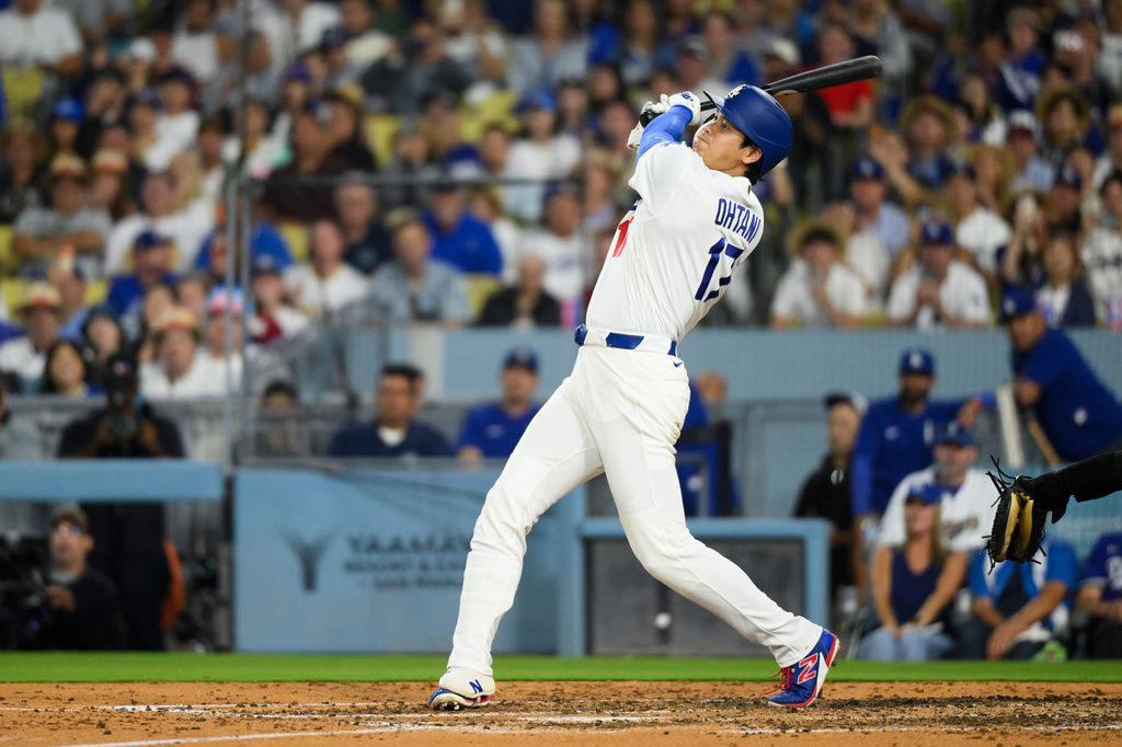 Los Angeles Dodgers' Shohei Ohtani hits a fly ball during the fourth inning of a baseball game against the San Diego Padres in Los Angeles, Thursday, July 2, 2026. (AP Photo/Kyusung Gong)