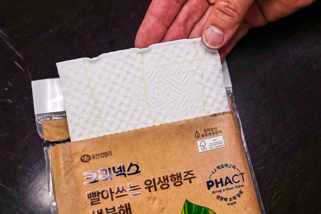 A multi-use compostable paper towel that contains plastic from plants is displayed at CJ Biomaterials, Monday, Aug. 3, 2026, in Woburn, Mass. (AP Photo/Charles Krupa)