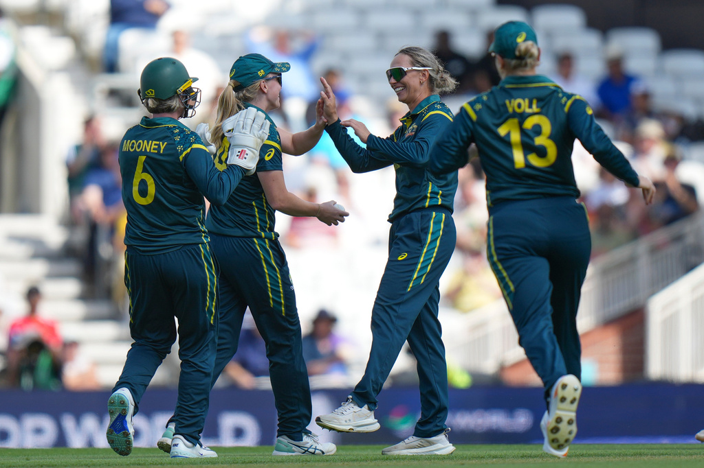 Australia's Ashleigh Gardner, second from right, celebrates with teammates the wicket of West Indies' Stafanie Taylor during the Women's T20 Cricket World Cup semifinal between Australia and West Indies in London, Tuesday, June 30, 2026. (AP Photo/Alastair Grant)