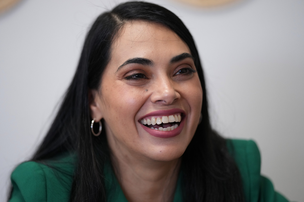 Rep. Mayra Flores, R-Texas, left, visits at a coffee shop, in Corpus Christi, Texas, Wednesday, Feb. 11, 2026. (AP Photo/Eric Gay)